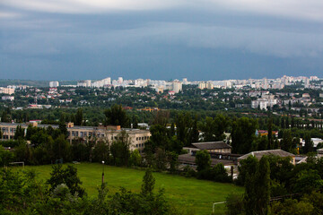 Fototapeta na wymiar Chisinau, the capital city of the Republic of Moldova. Storm clouds over city. Cloud over the city at the sunset.