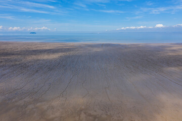Fototapeta na wymiar Sand Bay Beach tide out from drone