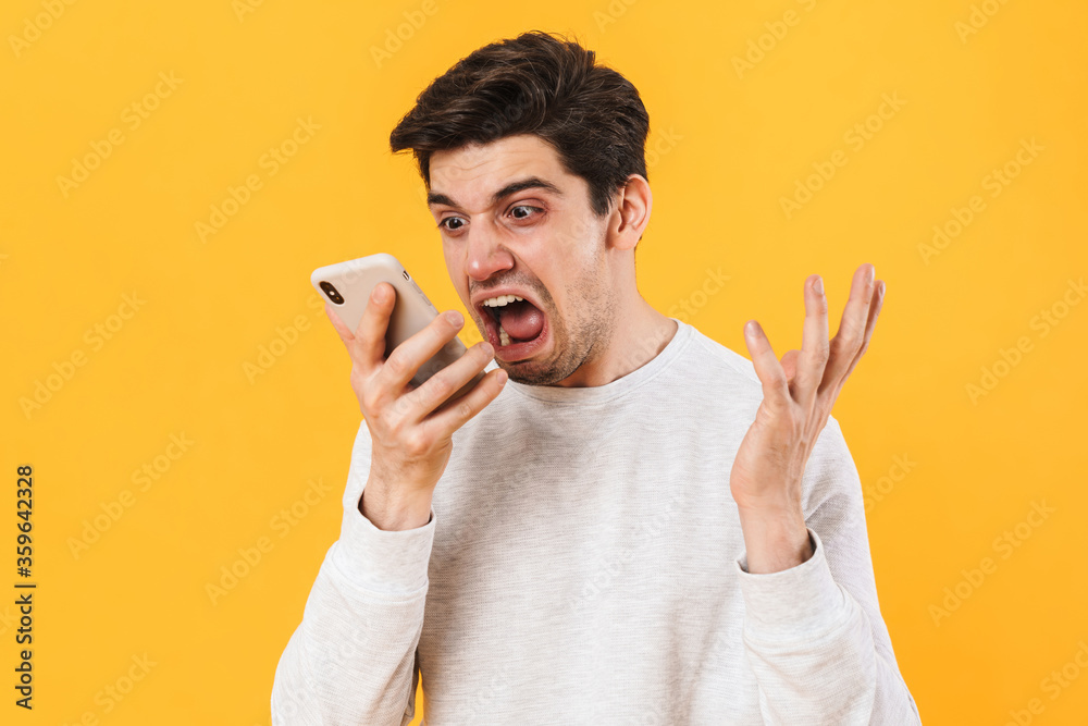 Poster photo of furious sick man screaming while talking on smartphone