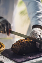 Slicing a freshly baked bread