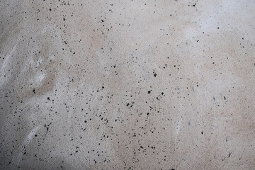 Grey-brown concreted wall for internal rooms or external open surface of polished concrete. Cement, sand and stone tones vintage, natural patterns vintage, design artwork floor texture background