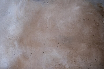 Grey-brown concreted wall for internal rooms or external open surface of polished concrete. Cement, sand and stone tones vintage, natural patterns vintage, design artwork floor texture background