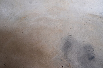 Grey-brown concreted wall for internal rooms or external open surface of polished concrete. Cement, sand and stone tones vintage, natural patterns vintage, design artwork floor texture background