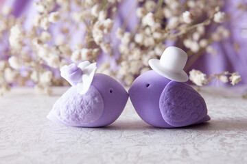 Wedding birds on a festive background with flowers. Wedding day concept