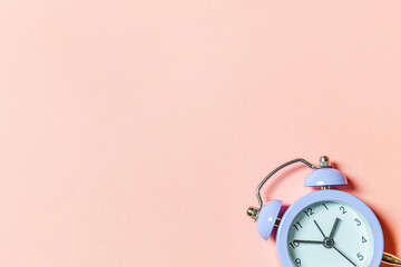 Simply minimal design ringing twin bell vintage classic alarm clock Isolated on pink pastel...