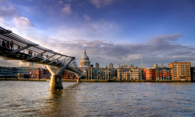 Millennium Bridge with St. Pauls Cathedral on the other side of the river Thames in London