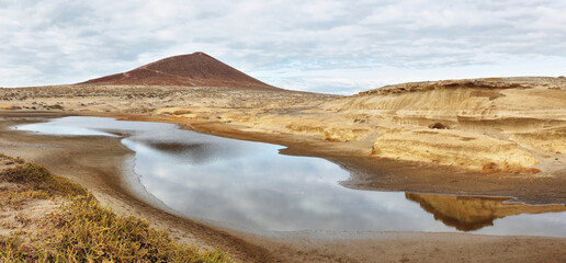 El Medano beach with red mountain at background, Tenerife, Canary Islands, Spain