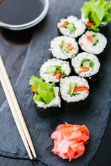 maki roll with vegetables on a slate plate