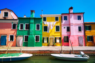 Fototapeta na wymiar Burano traditional vivid colorful houses vibrant colors island