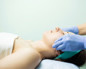 Photo of woman making facial massage, beauty and health concept.