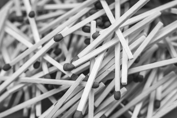 Scattered on a pile of wooden sticks matches