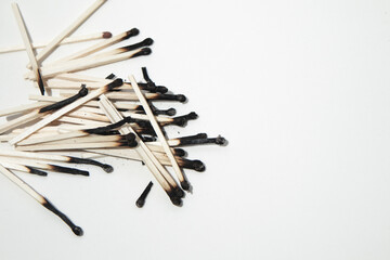 Burned sticks on a white background