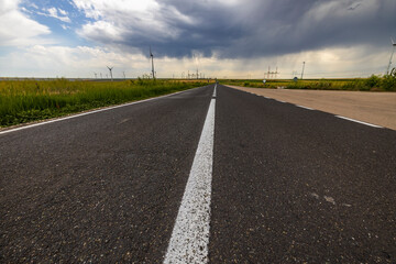 Wind turbines generator for clean energy in the filed on a storm day