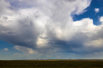 Wind turbines generator for clean energy in the filed on a storm day