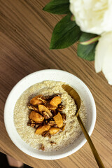 Coconut cream quinoa with caramelised peaches and pecan 