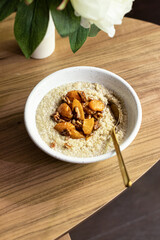 Coconut cream quinoa with caramelised peaches and pecan 