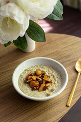 Coconut cream quinoa with caramelised peaches and pecan 