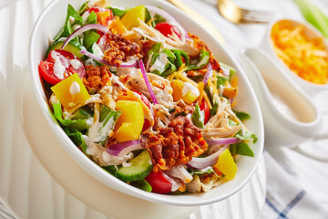 close-up of chicken club salad in bowl