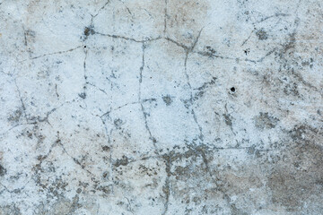 Close up of grey concrete wall with detailed surface patterns and textures. Grunge background with copy space.