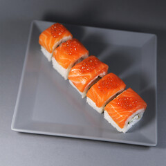 Japanese rolls on grey background.