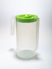 plastic water jug with green lid