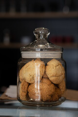 coconut cookies in a glass jar, close up