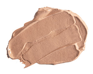 Smudged stain of a cream foundation isolated on white