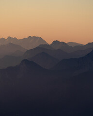 layers of mountains during sunrise
