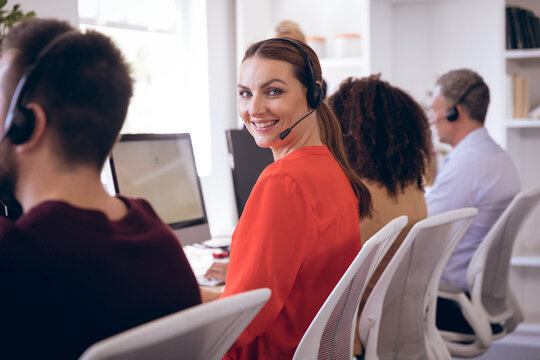Portait of a happy Caucasian businesswoman with headset