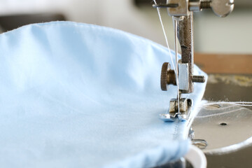 Closeup fabric mask on old sewing machine