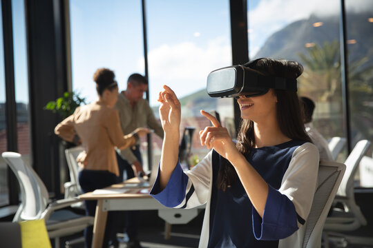 Business people using VR headset