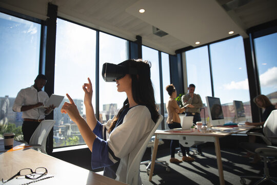 Business people using VR headset