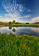 Beautiful spring sunrise over river banks