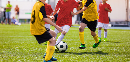 Kids Play Soccer Game. Children Outdoor Football Tournament Match on Grass Field © matimix