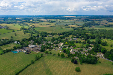 Fototapeta na wymiar Cotswold village and landscape from drone
