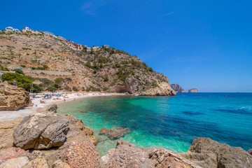 Cala Granadella beach with blue sea water, Spain