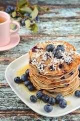 Gluten free buckwheat banana coconut blueberry pancakes with tea