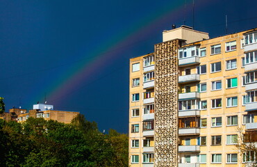 Fototapeta premium Rainbow over residential houses