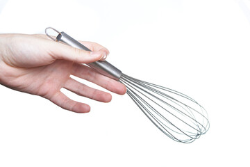 hand holds a kitchen whisk, isolated on white