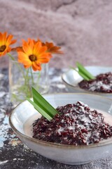 Bubur Ketan Hitam, Indonesian dessert. Black glutinous rice porridge with coconut milk, palm sugar and pandan leaf.
