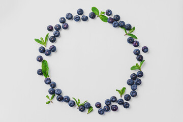 Circle of blueberries on white background, top view