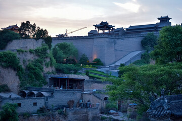 Fototapeta premium Chinese ancient buildings in the setting sun