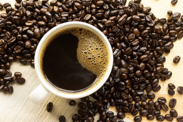 Top view of hot coffee on wood table