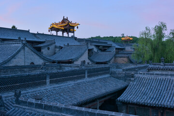 Chinese ancient buildings in the setting sun