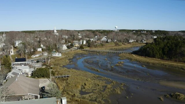The opening shot is Uncle Tim's Bridge. The camera pulls out to reveal Uncle Tim's island and the town of Wellfleet. You can see the salt marsh and some of the harbor.