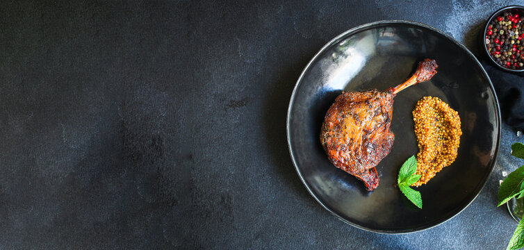 duck confit leg baked poultry meat Menu concept serving size. food background top view copy space organic healthy eating 