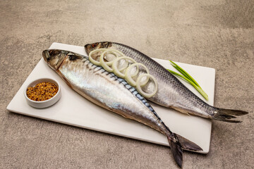 Pickled whole mackerel and herring. Traditional seafood delicacy, healthy eating concept