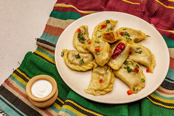 Dumplings stuffed stewed cabbage and sour cream. Traditional Ukrainian dish varenyky