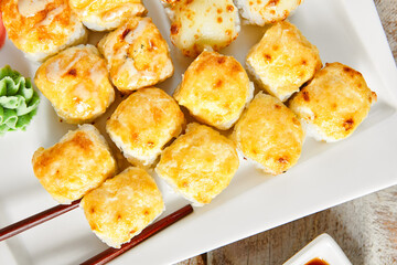 Baked rolls in white plate top view