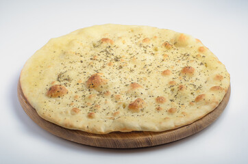 Focaccia with herbs. On a white background. For use on Italian food delivery resources and menu design.